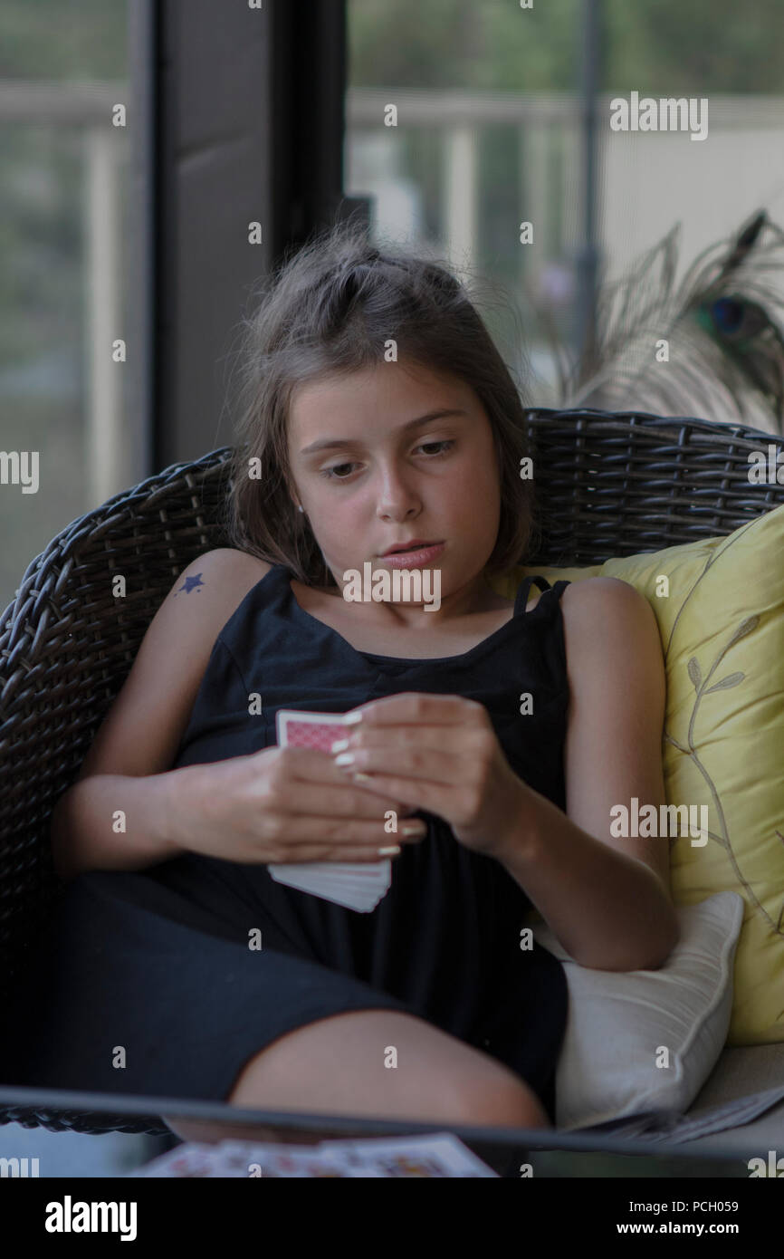Preteen girl sitting in chair hi-res stock photography and images - Alamy