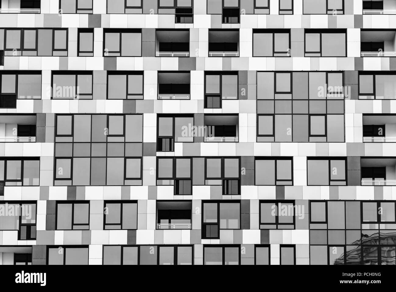 Detail of the facade of a multistory building. Building, unusual facade ...
