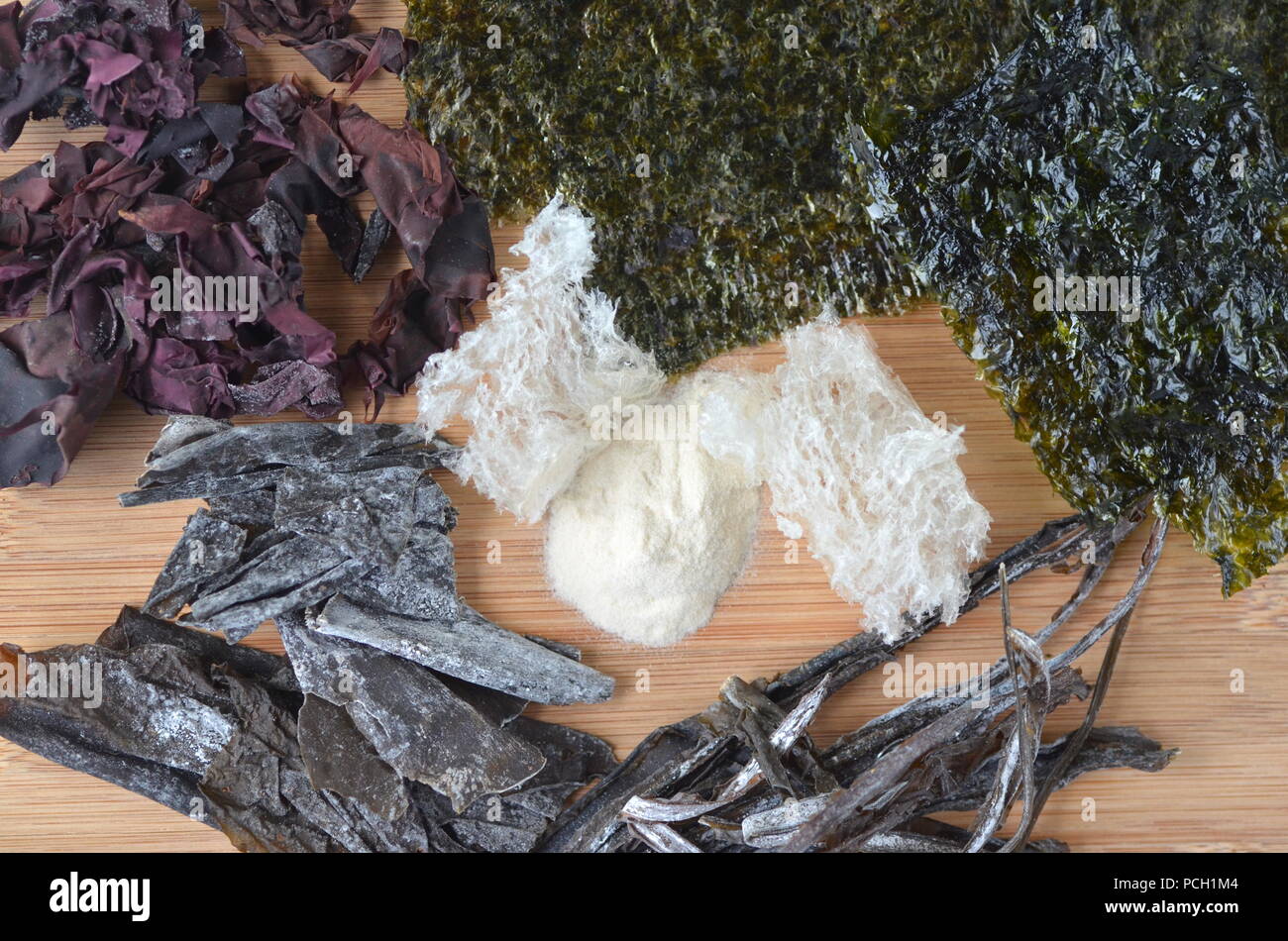 Detail top view of dried seaweed nori, dulse, kelp, wakame, agar agar, alaria. Isolated on