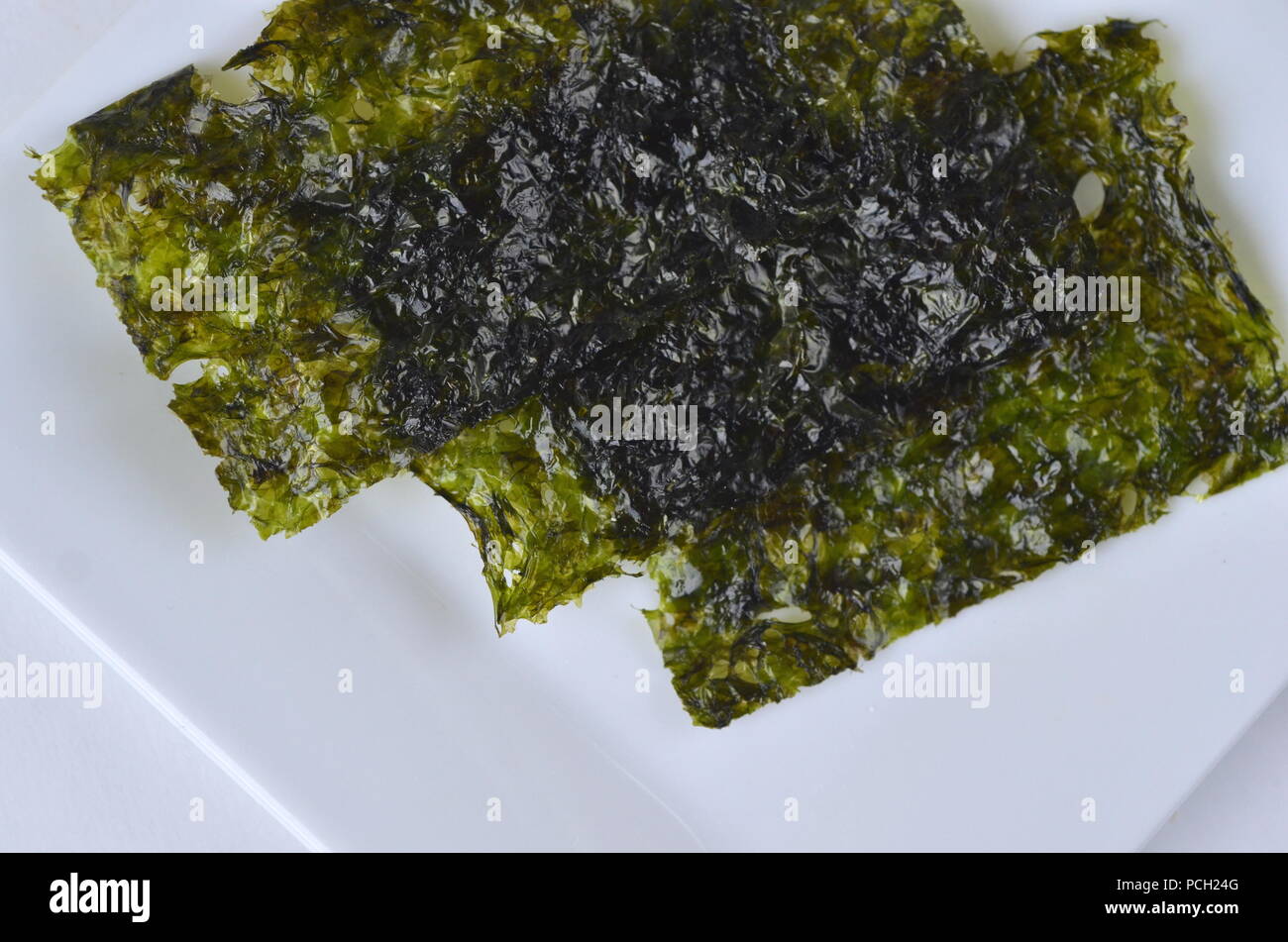 Detail top view of dried seaweed nori. Isolated on white.Nutrient rich vegan, raw and healthy