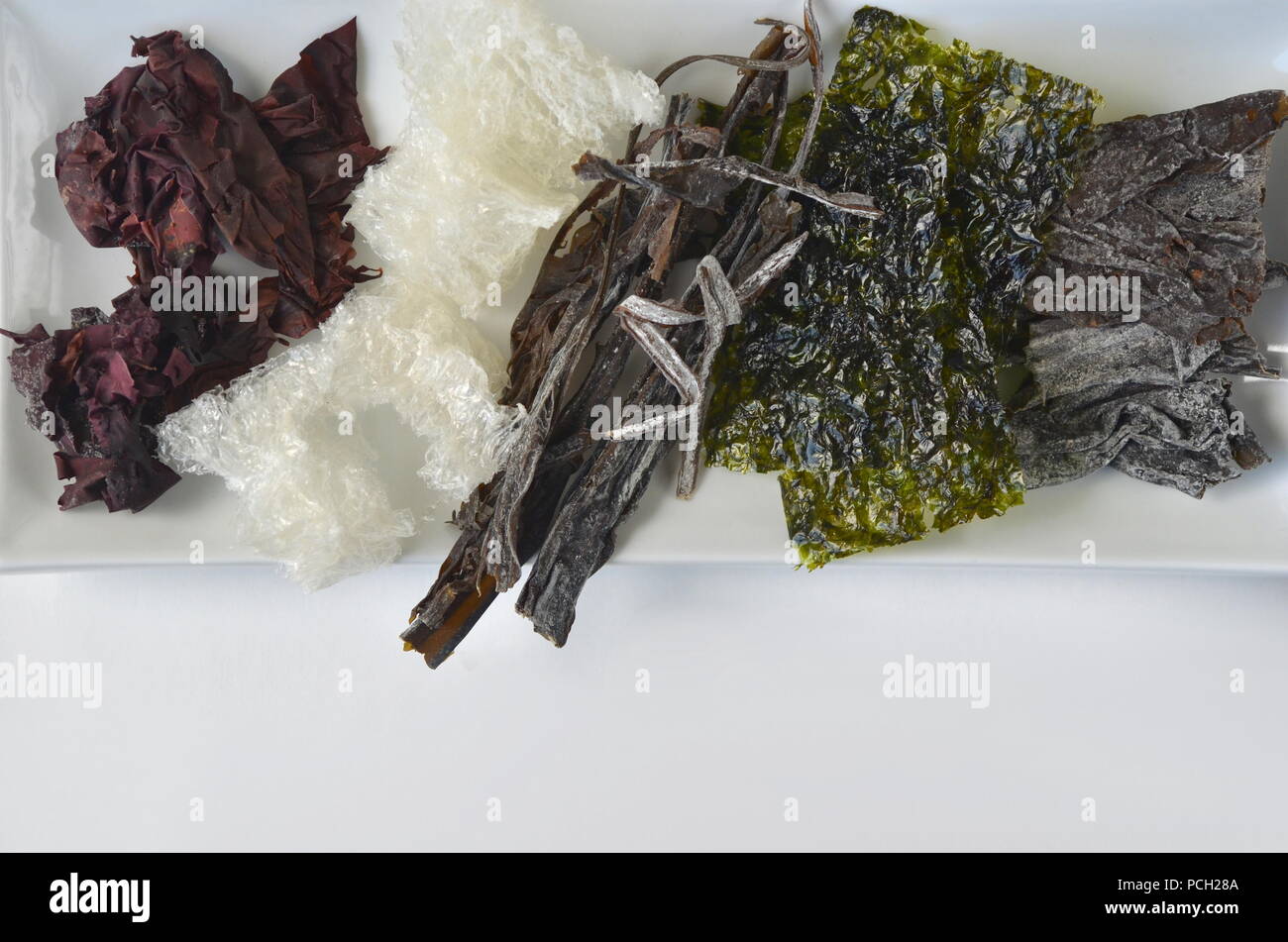 Detail top view of dried seaweed nori, dulse, kelp, wakame, agar agar