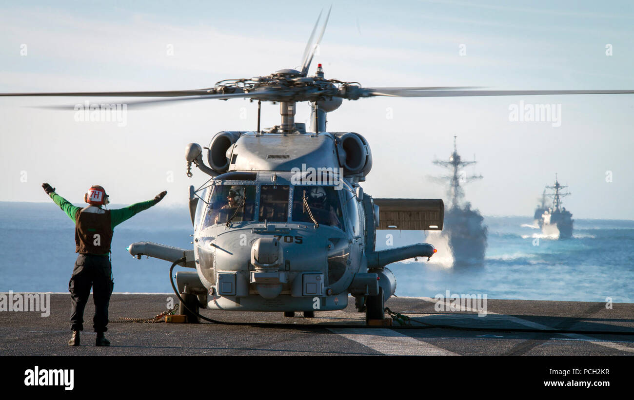 PACIFIC OCEAN (Nov. 11, 2016) A Helicopter Maritime Strike Squadron (HSM) 78 MH-60R Sea Hawk helicopter prepares to take off from the aircraft carrier USS Carl Vinson (CVN 70) flight deck. Carl Vinson is currently underway conducting Composite Training Unit Exercise (COMPTUEX) in preperation for an upcoming deployment. Stock Photo