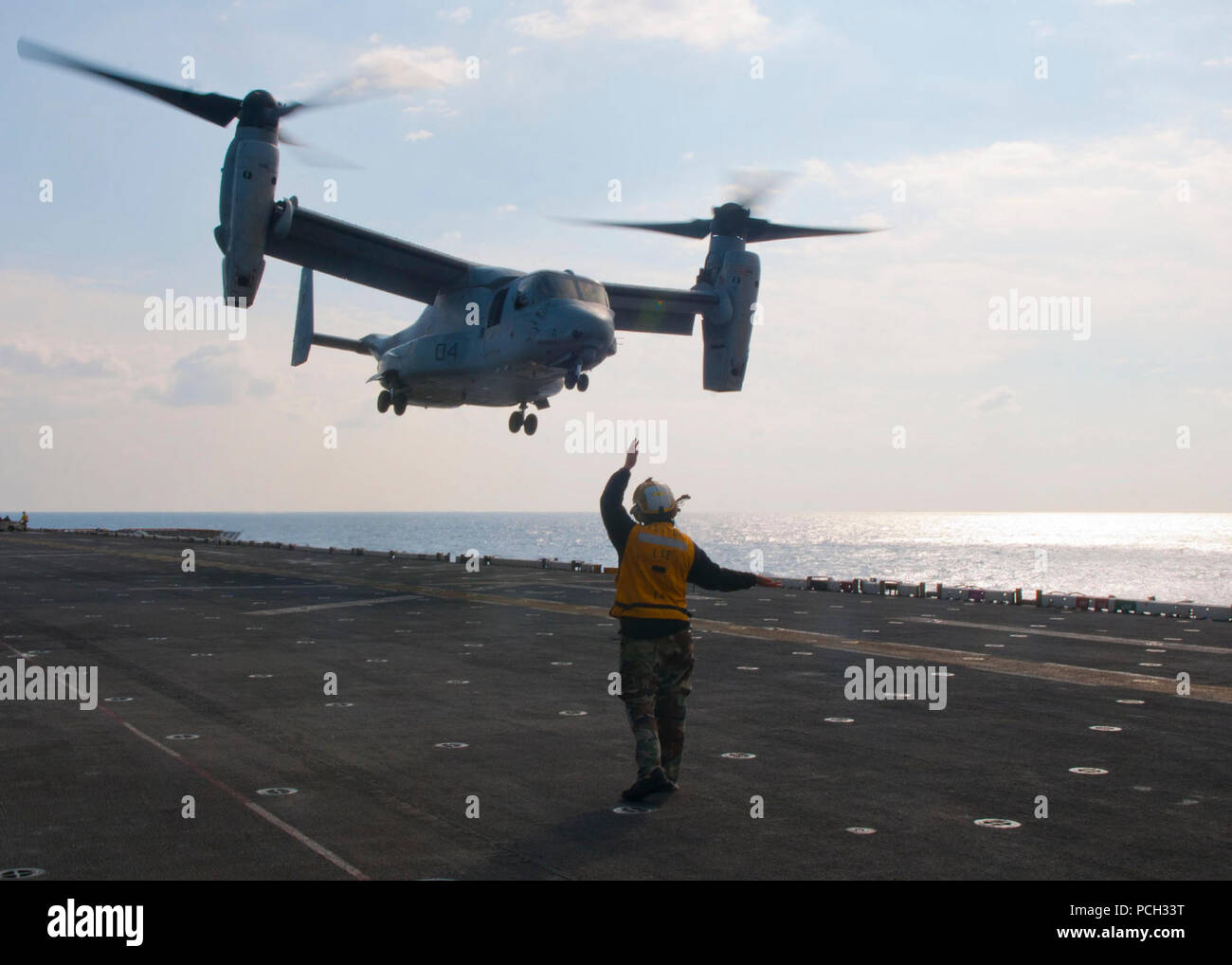 MEDITERRANEAN SEA (Nov. 24, 2012) Aviation Boatswain's Mate (Handling) 2nd Class Shannon R. Soderberg directs an MV-22 Osprey to takeoff during flight operations aboard the multipurpose amphibious assault ship USS Iwo Jima (LHD 7). Iwo Jima Amphibious Ready Group and embarked 24th Marine Expeditionary Unit (24th MEU) are deployed in support of maritime security operations and theater security cooperation efforts in the U.S. 6th Fleet area of responsibility. Stock Photo