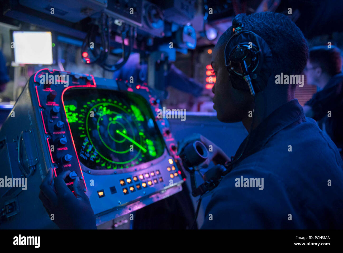 CARIBBEAN SEA (Oct. 16, 2017) Operations Specialist 3rd Class Terrell Clark tracks a landing craft utility transporting Marines from the amphibious assault ship USS Kearsarge to Puerto Rico in Kearsarge's combat information center. Kearsarge is assisting with relief efforts in the aftermath of Hurricane Maria. The Department of Defense is supporting the Federal Emergency Management Agency, the lead federal agency in helping those affected by Hurricane Maria to minimize suffering and is one component of the overall whole-of-government response effort. Stock Photo