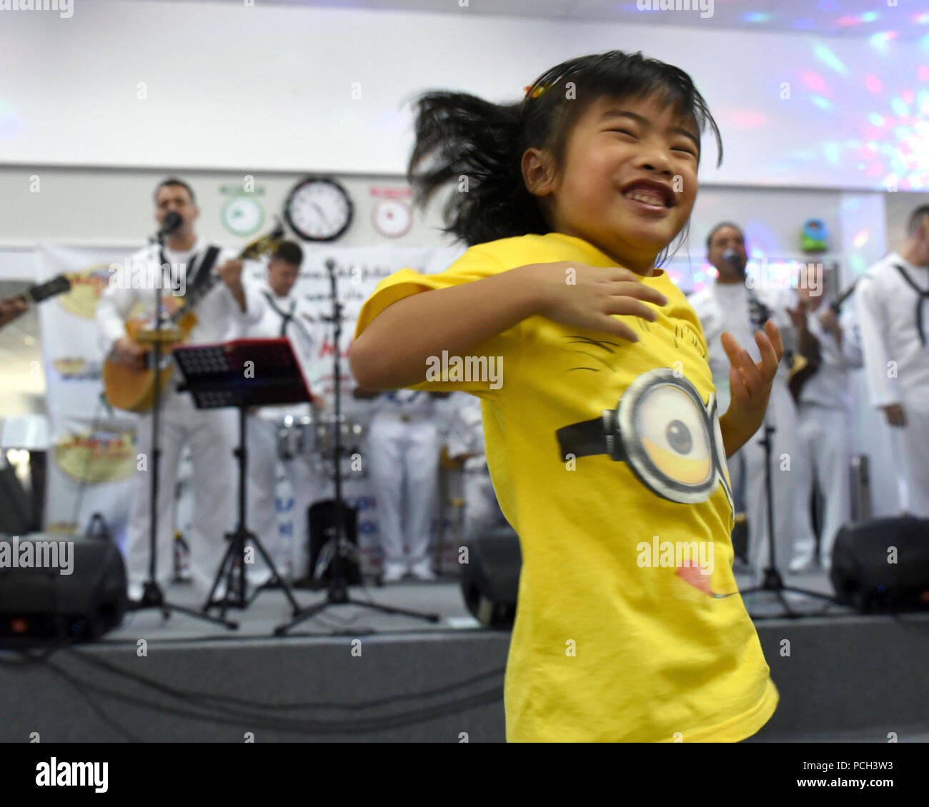 BANDAR SERI BEGAWAN, Brunei (November 4, 2015) A student from SMARTER Brunei, a center dedicated to helping people of all ages with autism, dances during a performance featuring both the U.S. 7th Fleet Band’s contemporary music ensemble Orient Express and the Royal Brunei Navy Band during Cooperation Afloat Readiness and Training (CARAT) Brunei 2015. CARAT is a series of annual, bilateral maritime exercises between the U.S. Navy, U.S. Marine Corps, and the armed forces of nine partner nations to include Bangladesh, Brunei, Cambodia, Indonesia, Malaysia, the Philippines, Singapore, Thailand, an Stock Photo