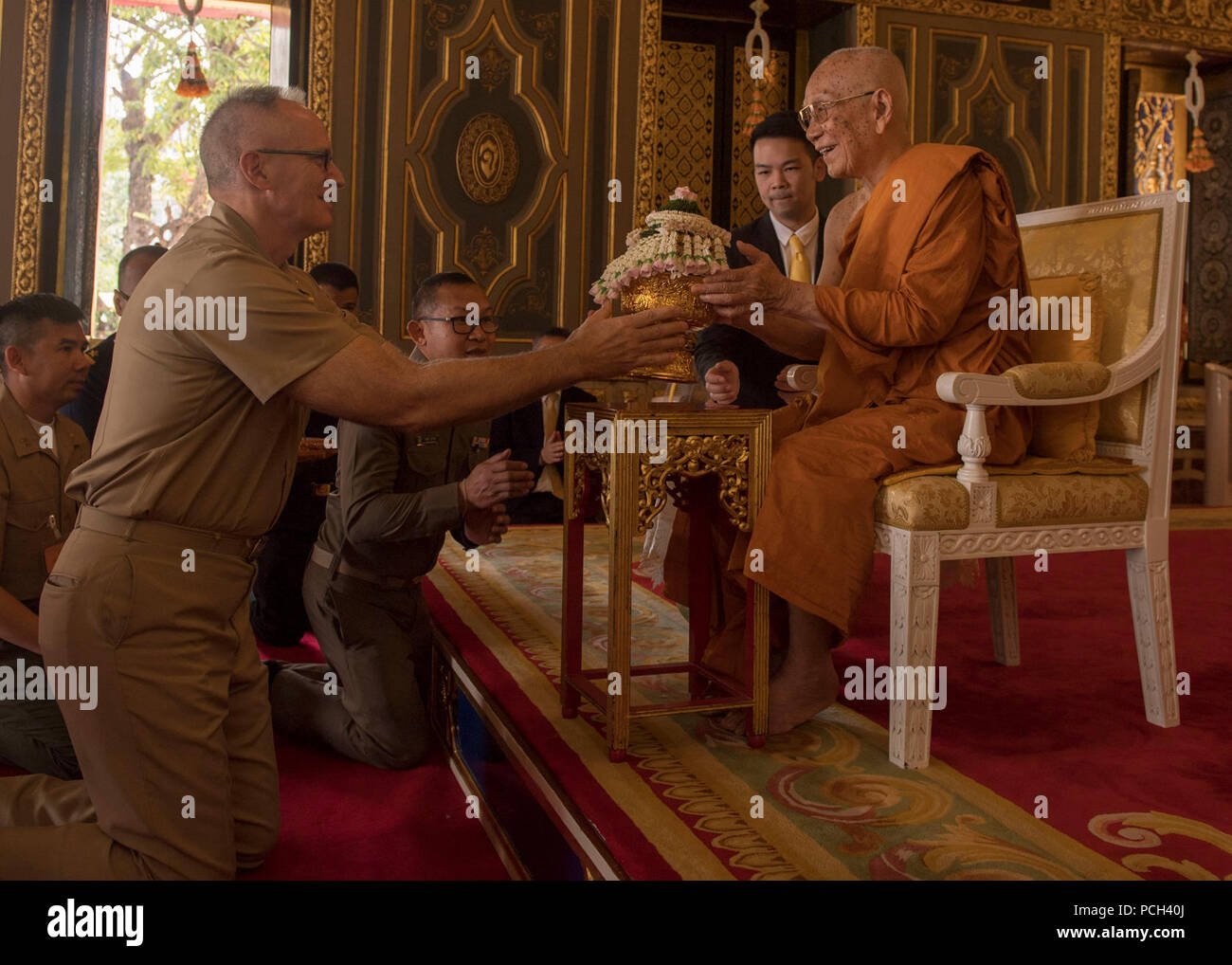 BANGKOK, Thailand (Feb. 12, 2018) Capt. James Johnson, a U.S. Navy  chaplain, presents a gift to the Supreme Patriarch of Thailand during Exercise Cobra Gold. Exercise Cobra Gold 2018 is an annual exercise conducted in the Kingdom of Thailand held from Feb. 13-23 with seven full participating nations. Stock Photo