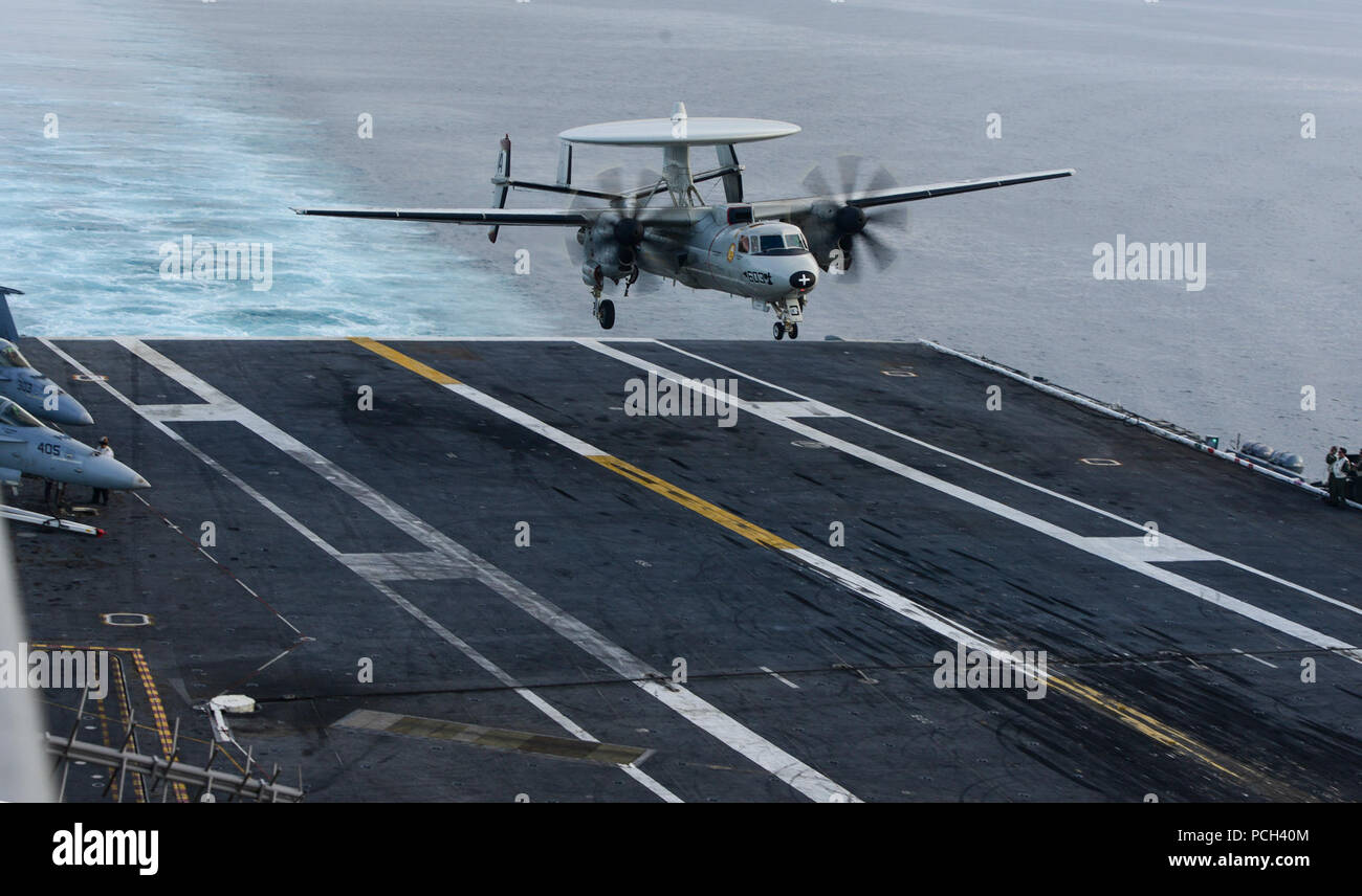 PACIFIC OCEAN (Jan. 19, 2014) An E-2C Hawkeye assigned to the Sun Kings of Carrier Airborne Early Warning Squadron (VAW) 116 lands on the aircraft carrier USS Carl Vinson (CVN 70). Carl Vinson is underway conducting training off the coast of Southern California. Stock Photo