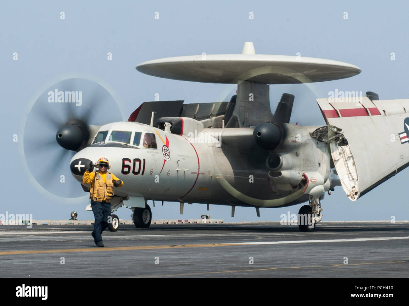 A U.S. Navy E-2C Hawkeye assigned to Carrier Airborne Early Warning Squadron (VAW) 124 taxis on the flight deck of the aircraft carrier USS George H.W. Bush (CVN 77) Sept. 1, 2014, in the Persian Gulf. The George H.W. Bush was supporting maritime security operations and theater security cooperation efforts in the U.S. 5th Fleet area of responsibility. Stock Photo