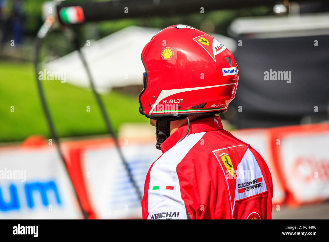 Mexico City, Mexico - July 08, 2015: Pit Crew waiting to Esteban Gutiérrez on its Ferrari F1 F60 Car to arrive to the Pit Stop for the Wheel Change. At the Scuderia Ferrari Street Demo By Telcel - Infinitum. Stock Photo