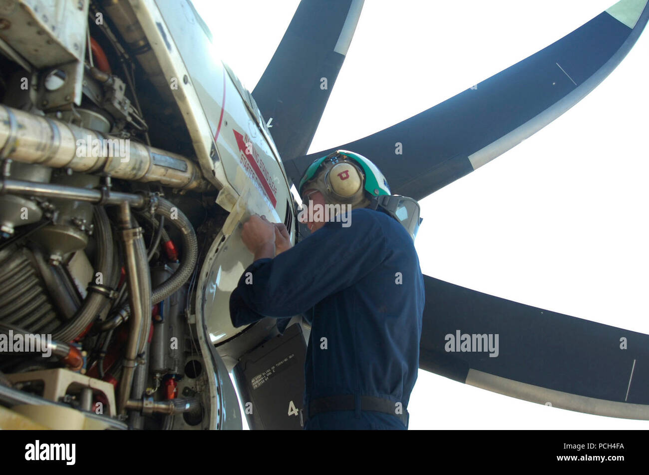 GUANTANAMO BAY, Cuba – Navy Petty Officer 3rd Class Ryan Adams seals panels on a C-2 Greyhound carrier onboard delivery aircraft as part of routine maintenance at U.S. Naval Station Guantanamo Bay airfield, Jan. 19, 2010. Adams is a member of Fleet Logistics Squadron VRC-40 and is deployed in support of Operation Unified Response, providing humanitarian assistance to Haiti.  (JTF Guantanamo Stock Photo