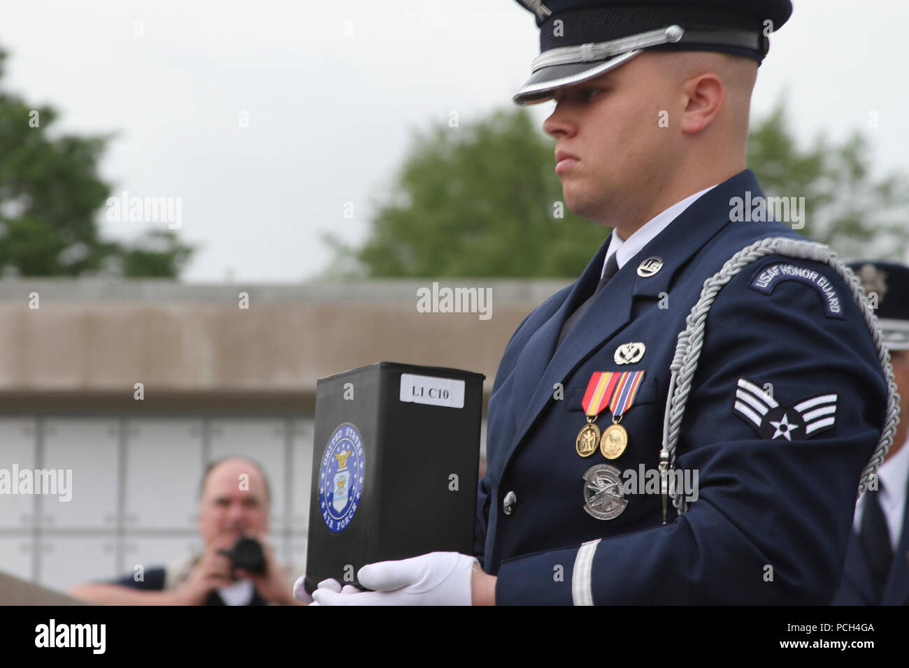 ARLINGTON, Va. – A U.S. Air Force honor guard member takes the remains of  Staff Sgt. Dennis Banks, a Vietnam War veteran, to a niche at Arlington National Cemetery’s new Columbarium Court No. 9  May 9, 2013 .  The cemetery dedicated its ninth columbarium court by conducting a joint full honors committal service for six unclaimed remains of veterans from all branches of the Armed Forces. The Norfolk District, U.S. Army Corps of Engineers, oversaw the construction of the columbarium, which spans more than 2 acres. Stock Photo
