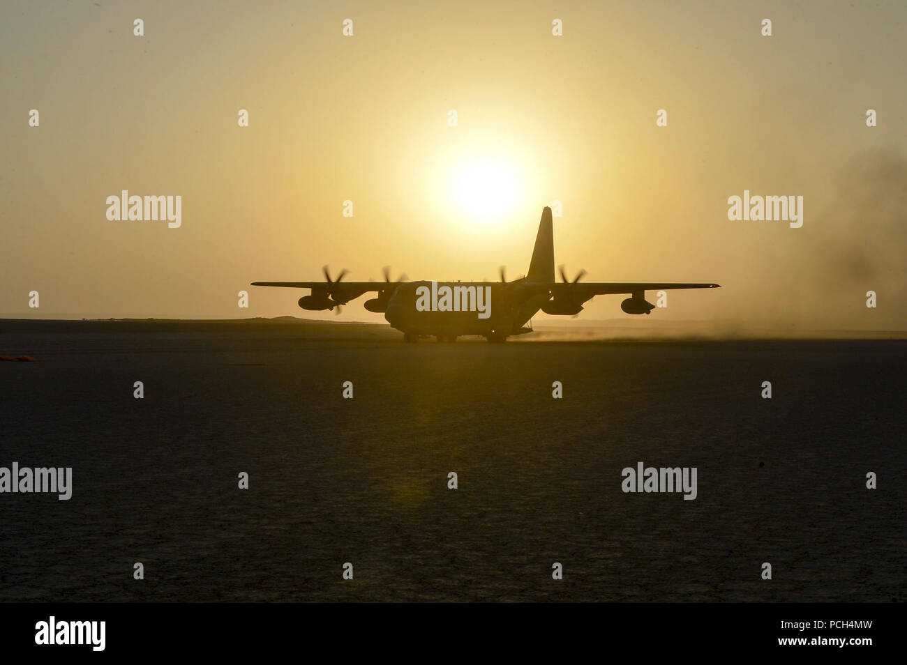 A U.S. Marine Corps KC-130J aircraft prepares for take off during aircraft landing zone training in support of Combined Joint Task Force-Horn of Africa, Jan. 28, 2017. The training allowed the aircraft pilots to re-certify their dirt landing qualification. Combined Joint Task Force-Horn of Africa is a multinational effort to conduct theater security cooperation, combat violent extremism and enable freedom of movement within East Africa in order to defend U.S. interests and support aligned regional efforts. Stock Photo