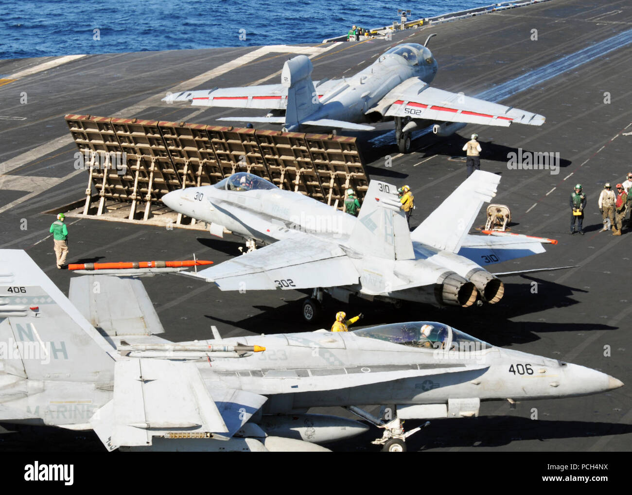 PACIFIC OCEAN (Nov. 11, 2012) Aircraft are maneuvered before launch aboard the aircraft carrier USS Nimitz (CVN 68). Nimitz is currently underway participating in the shipХs joint task force exercise (JTFEX). Stock Photo