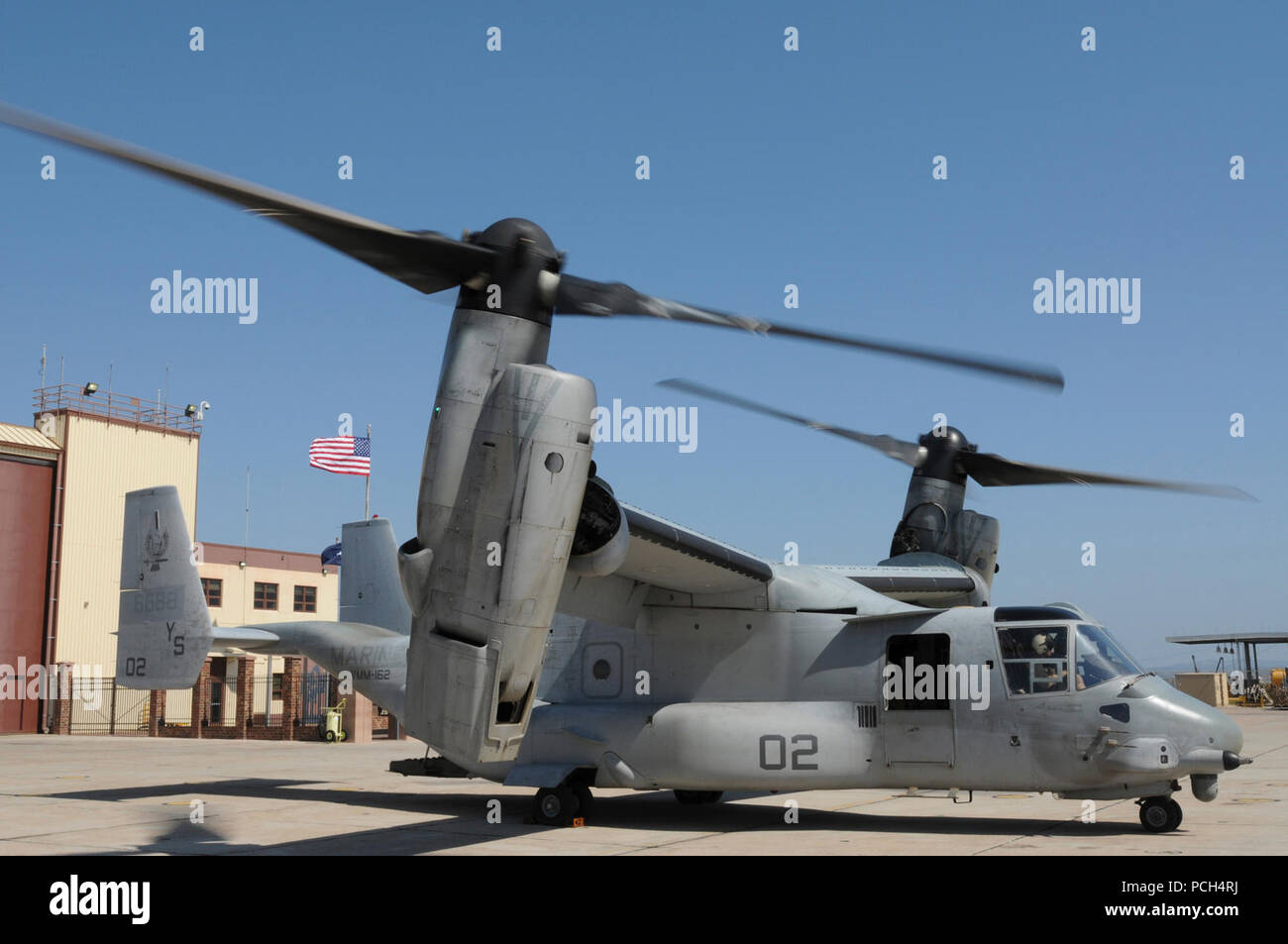 An MV-22 Osprey, from Marine Medium Tiltrotor Squadron 162, waits for supplies at U.S. Naval Station Guantanamo Bay, Jan. 24. The aircraft, scheduled to fly a mission to USS Bataan, is here in support of Operation Unified Response, providing humanitarian assistance to victims of the Jan. 12 earthquake in Haiti. Stock Photo