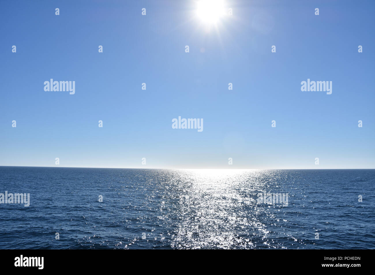 Cloudless evening sky and sun, North Sea. View from ship. June, 2018 Stock Photo