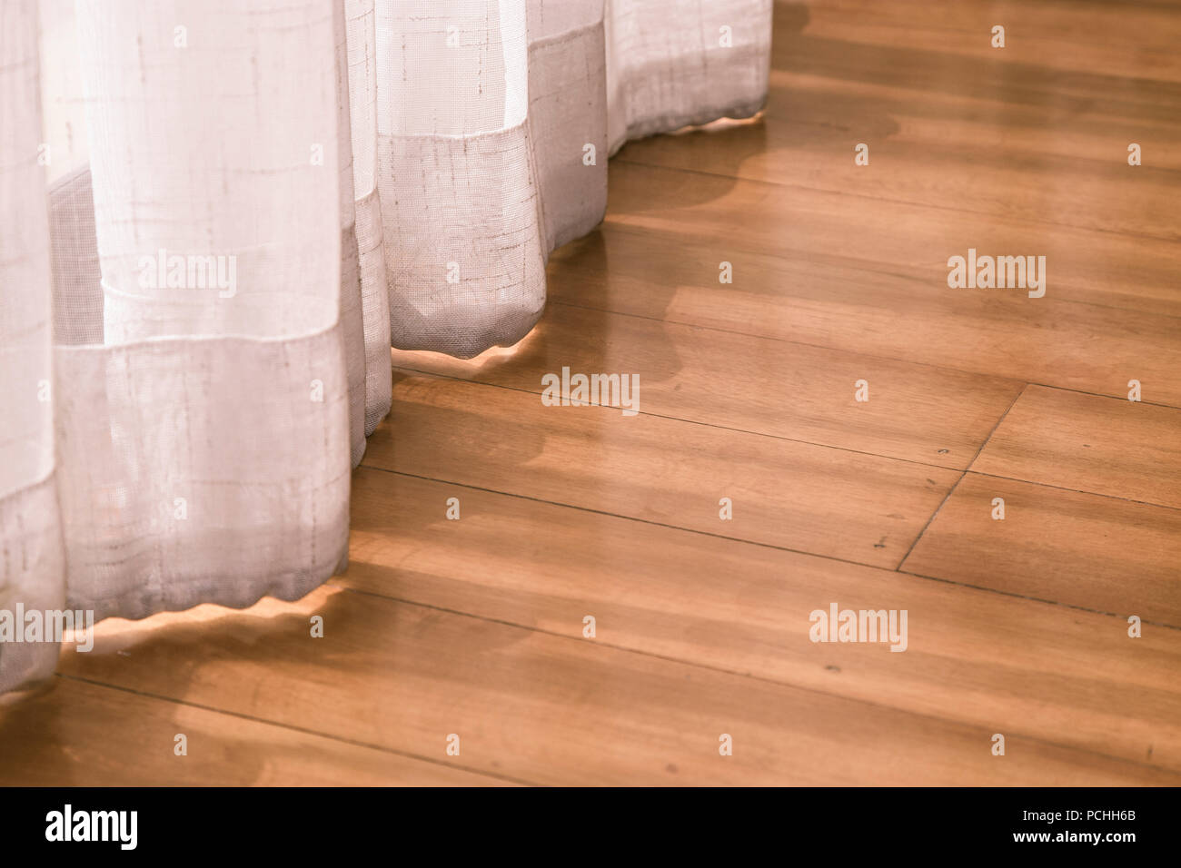 Sheer curtains blocking the sun in room Stock Photo - Alamy