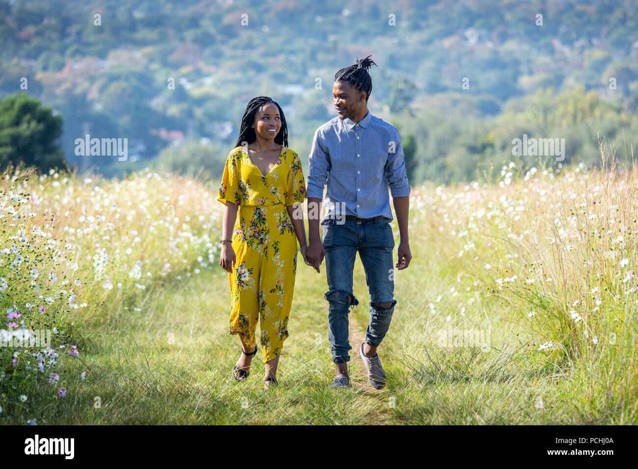 Couple holding each other hands hi-res stock photography and images - Alamy
