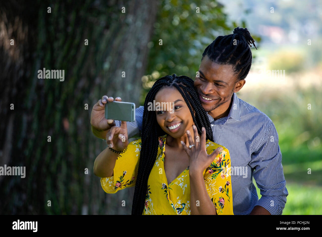 Couple taking a selfie with engagement ring Stock Photo