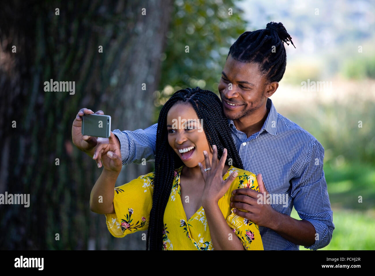 Couple taking a selfie with engagement ring Stock Photo