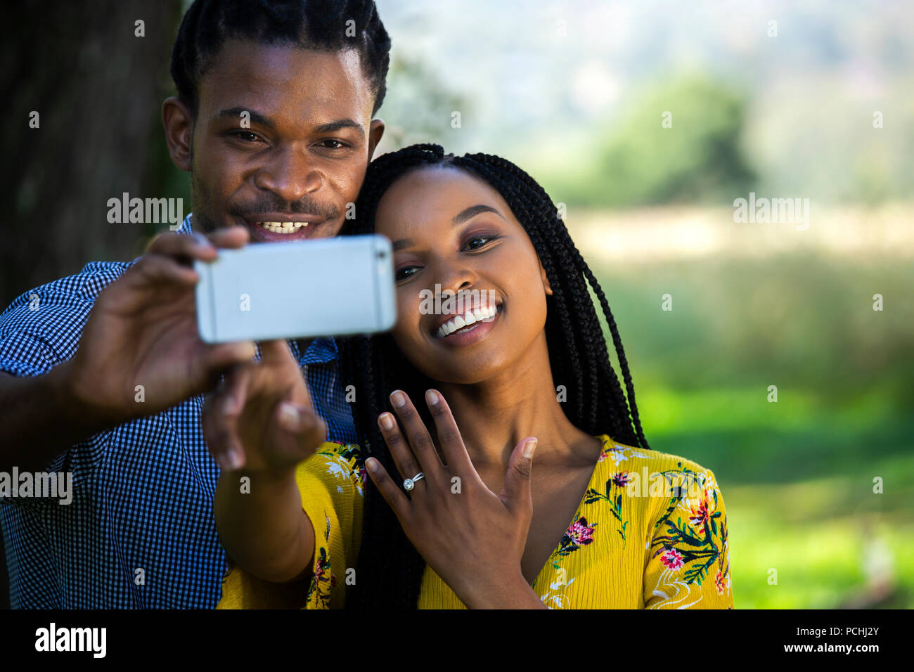 Couple taking a selfie with engagement ring Stock Photo