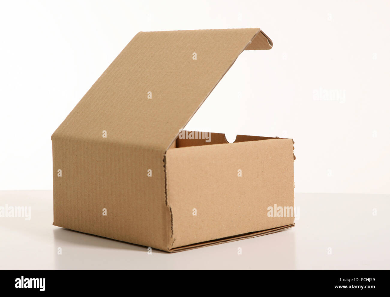 carton package box over white background Stock Photo