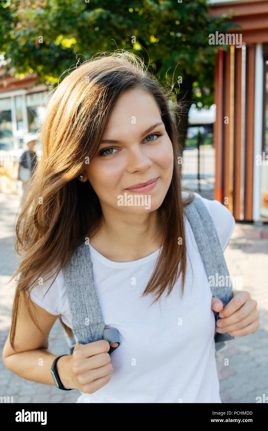 holding backpack straps