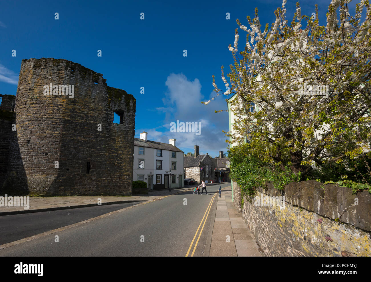 Road beside the old town walls at Conwy in North Wales, UK. A sunny spring day. Stock Photo