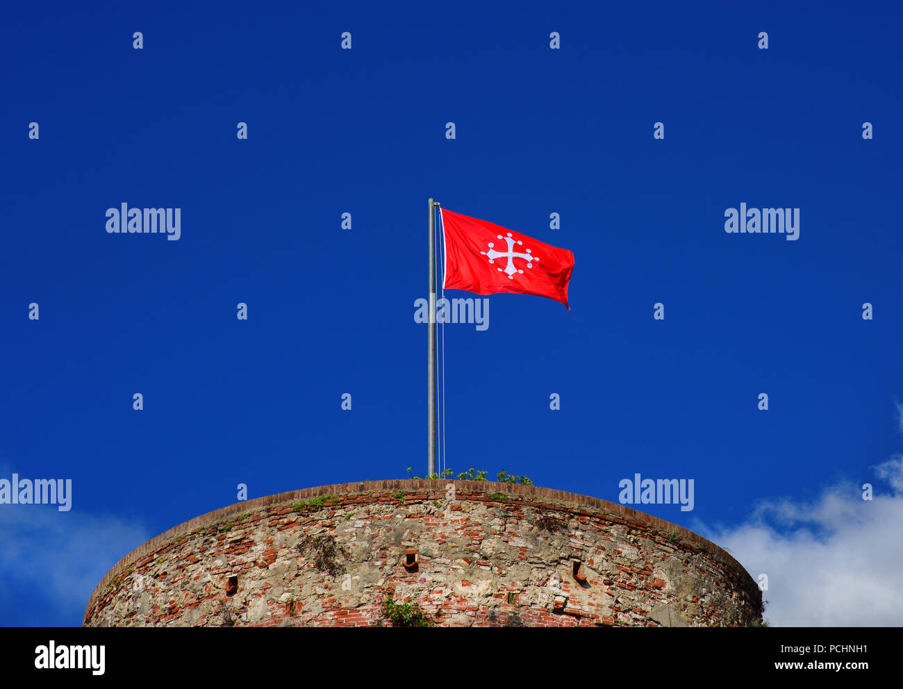 Republic of Pisa old red flag with white cross, one of the most powerful ancient Maritime Republic in the Mediterranean Sea during the Middle Ages Stock Photo