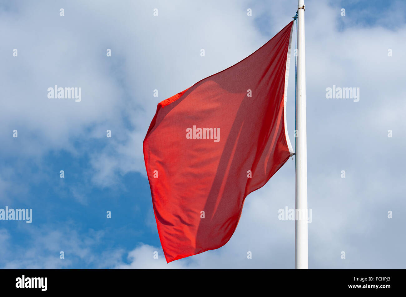 Red warning flag at military firing range, Salisbury Plain, Wilshire, UK. Stock Photo