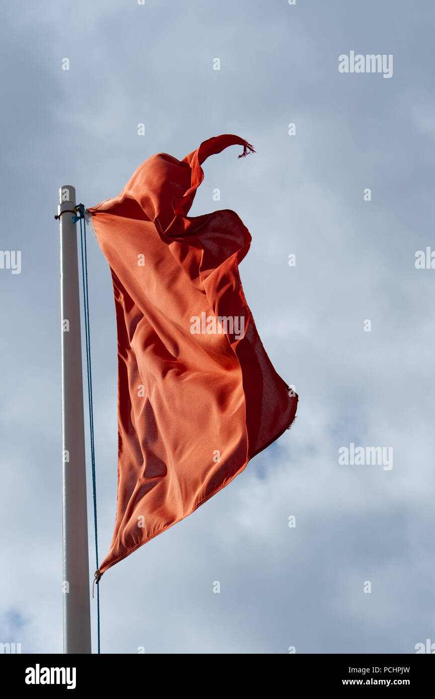 Red warning flag at military firing range, Salisbury Plain, Wilshire, UK. Stock Photo