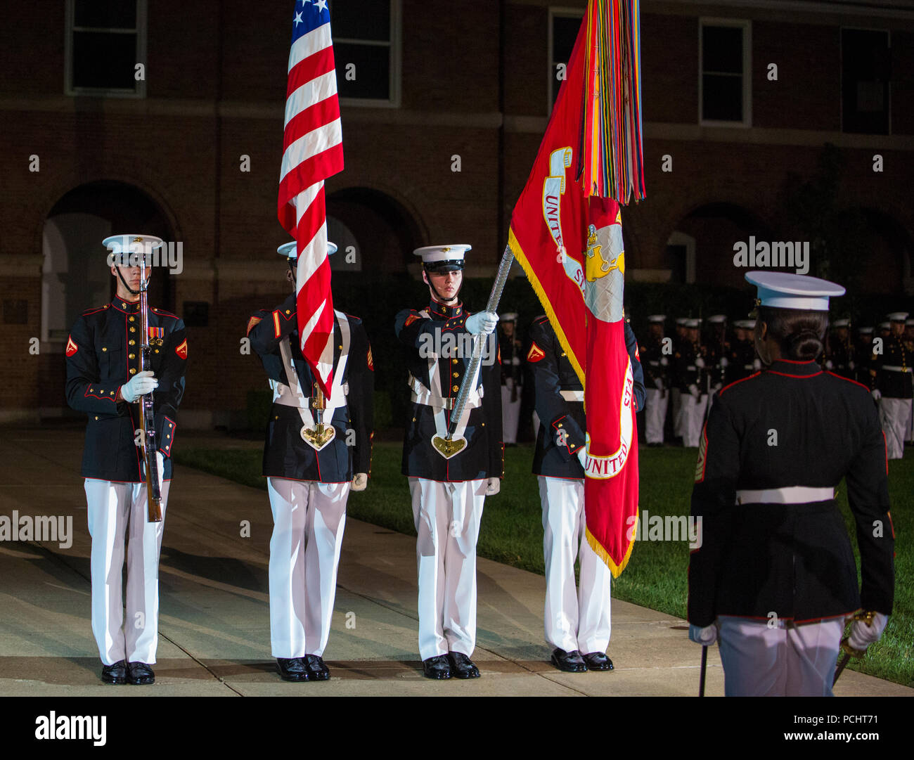 Marines with the U.S. Marine Corps Color Guard present the National