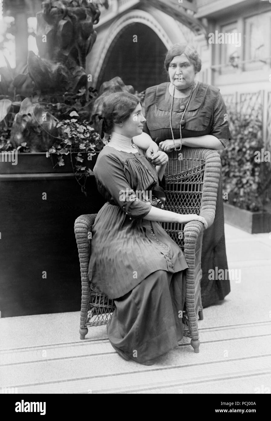 Helen Keller, seated with her teacher and companion Anne Sullivan Macy at the International Flower Show April 1913 in New York City, New York. Helen Keller (June 27, 1880 – June 1, 1968) was an American author, political activist, and lecturer. She was the first deaf-blind person to earn a bachelor of arts degree. Stock Photo