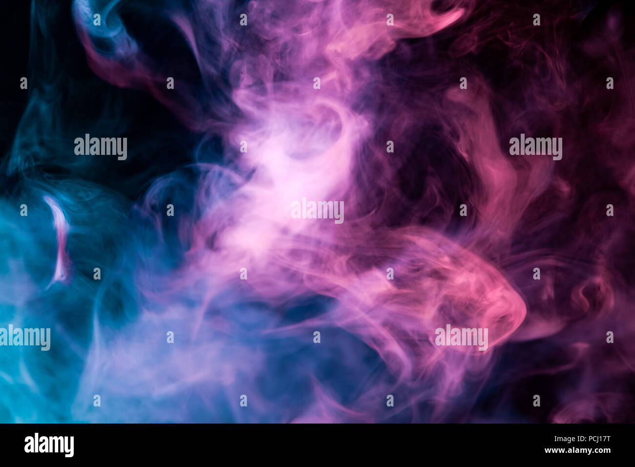 Dense Multicolored Smoke Of Blue Pink And Purple Colors On A Black Isolated Background Background Of Smoke Vape Stock Photo Alamy
