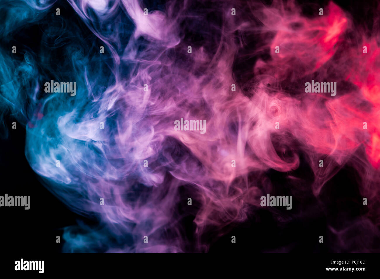 Dense Multicolored Smoke Of Blue Pink And Purple Colors On A Black Isolated Background Background Of Smoke Vape Stock Photo Alamy