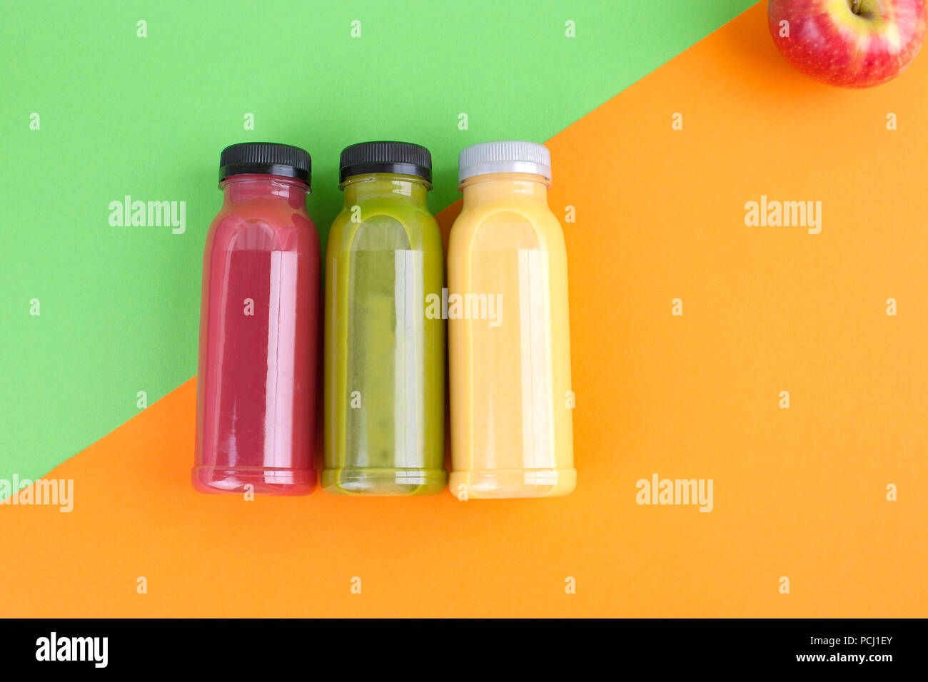 different juice in bottles. A healthy meal with you. Detox drinks are fresh. Top view Stock Photo