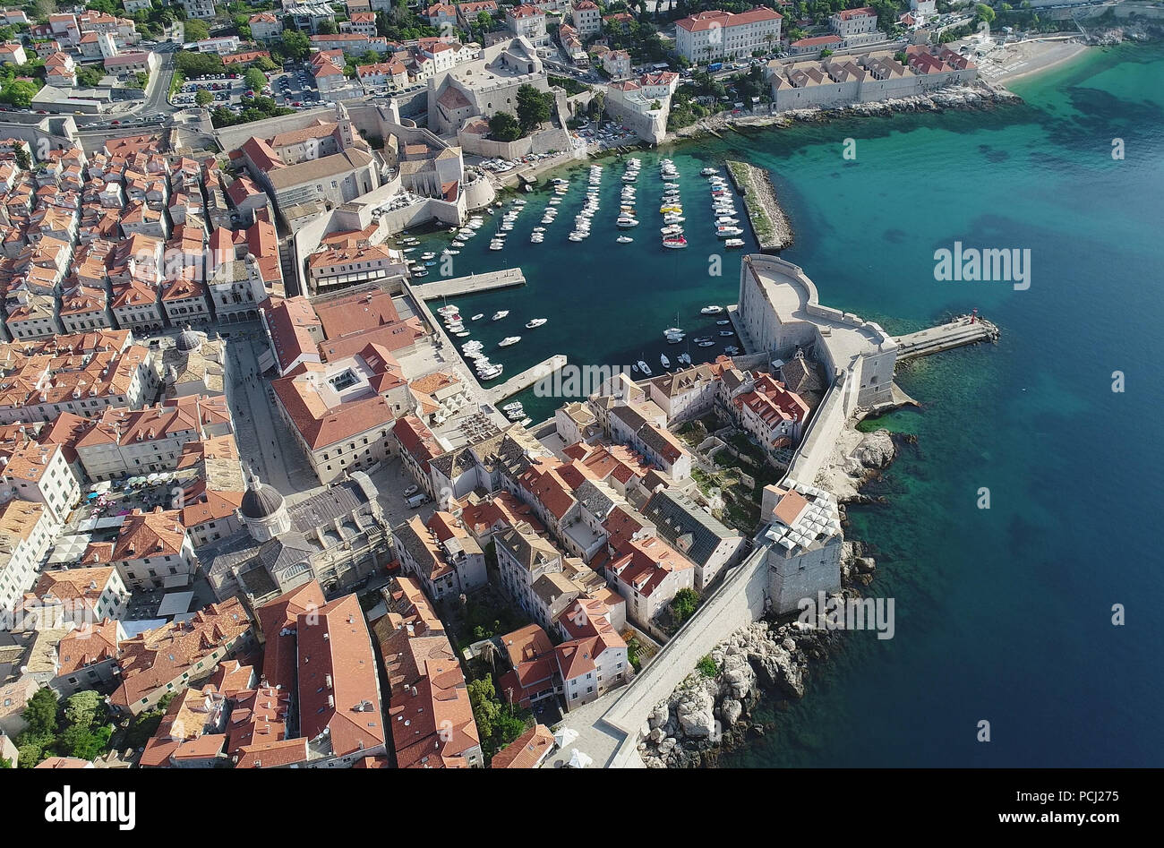 Town of Dubrovnik city walls and harbor UNESCO world heritage site aerial view, Dalmatia region of Croatia Stock Photo