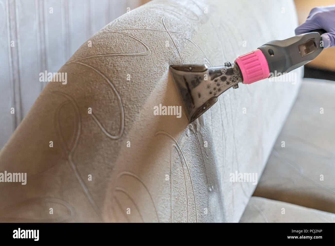 Closeup of upholstered Sofa chemical cleaning Stock Photo Alamy