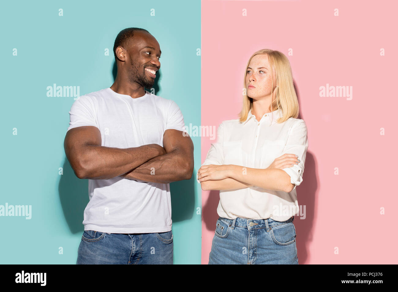 Closeup portrait of young couple, man, woman. One being excited happy ...