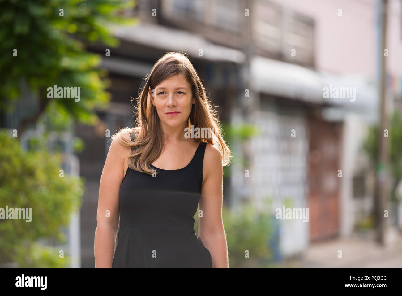 Young beautiful woman in the streets outdoors Stock Photo