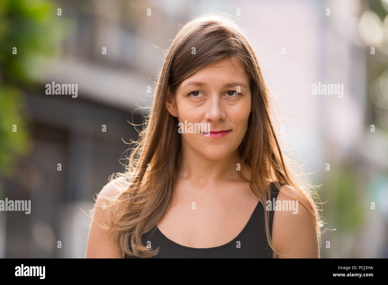 Young beautiful woman in the streets outdoors Stock Photo