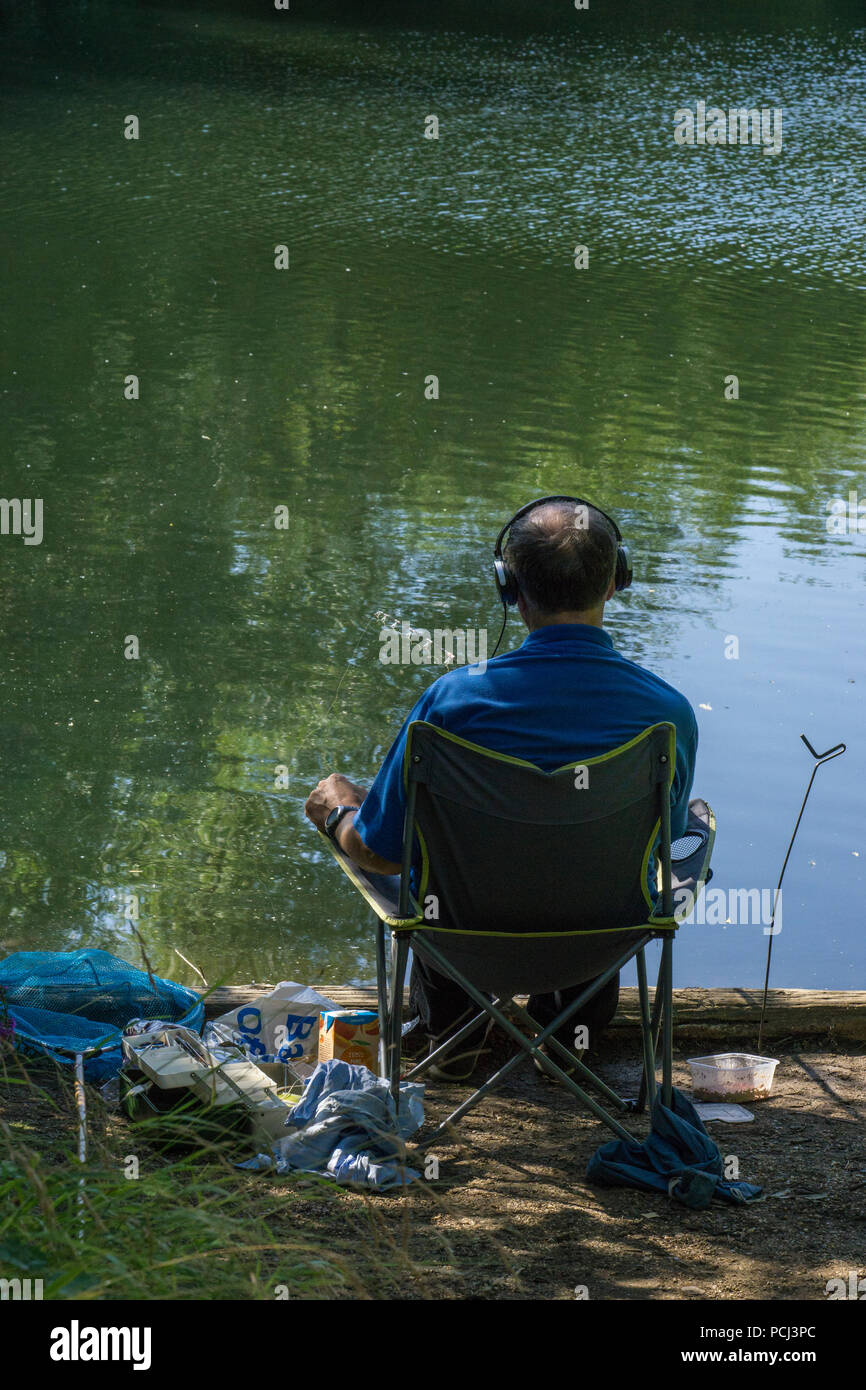 Fishing to sound of music Stock Photo