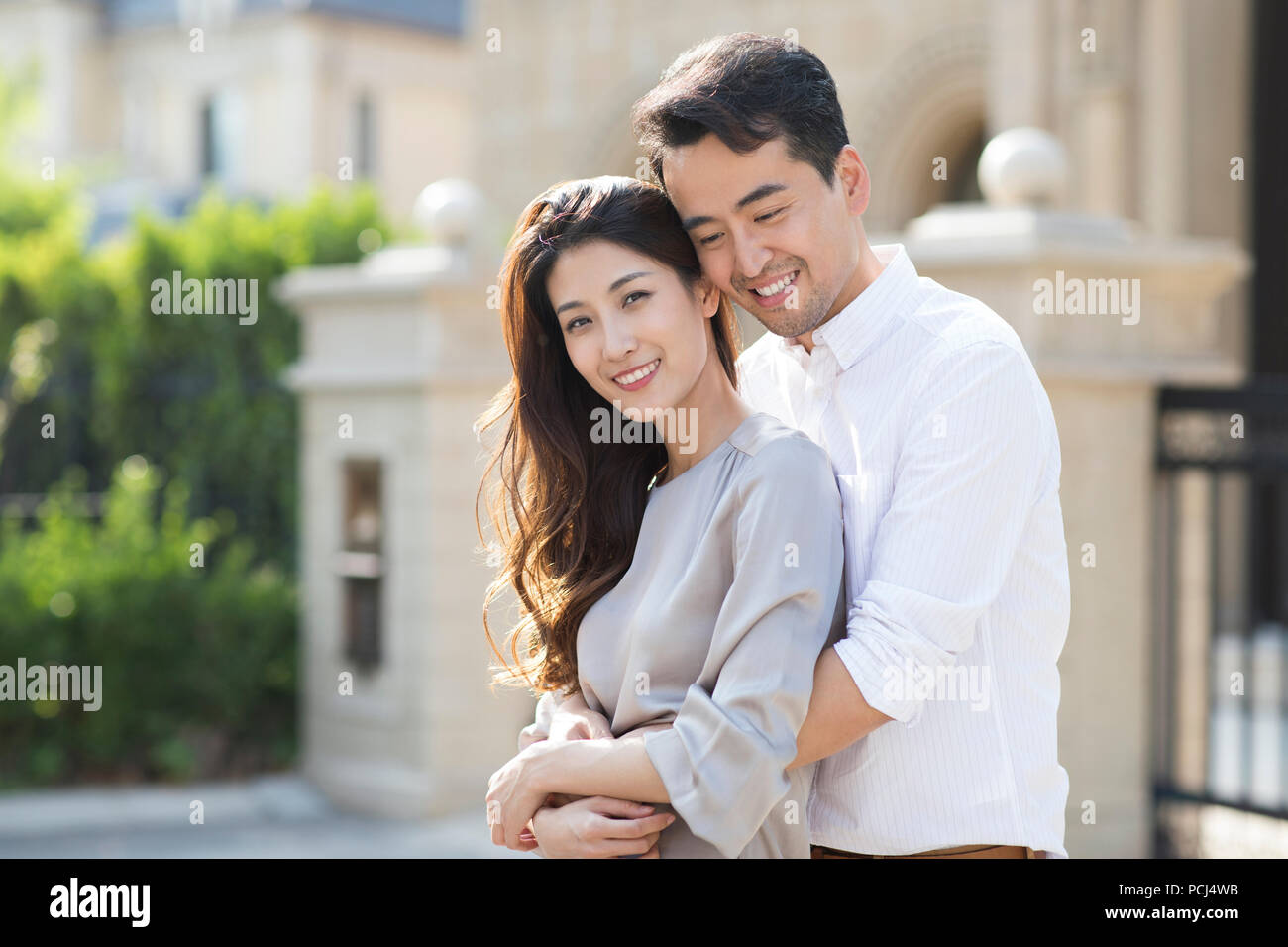 Portrait of cheerful young Chinese couple Stock Photo - Alamy