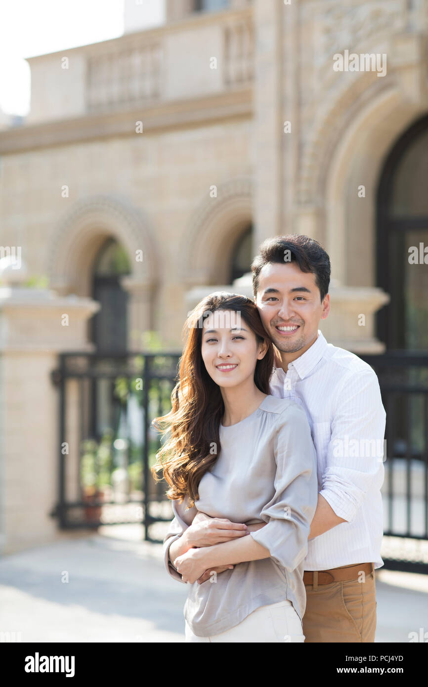 Portrait of cheerful young Chinese couple Stock Photo - Alamy