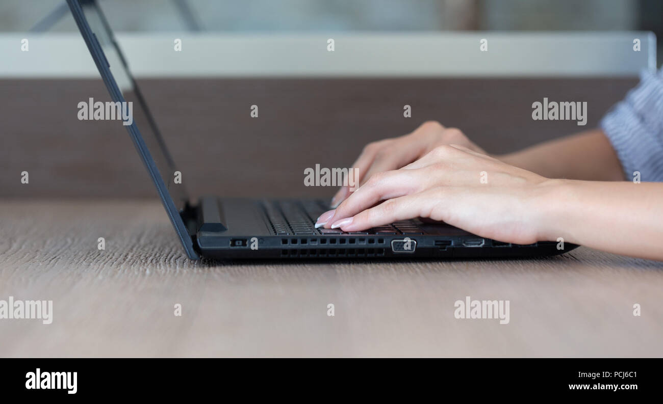 Young caucasian woman hands typing on tablet closeup Stock Photo
