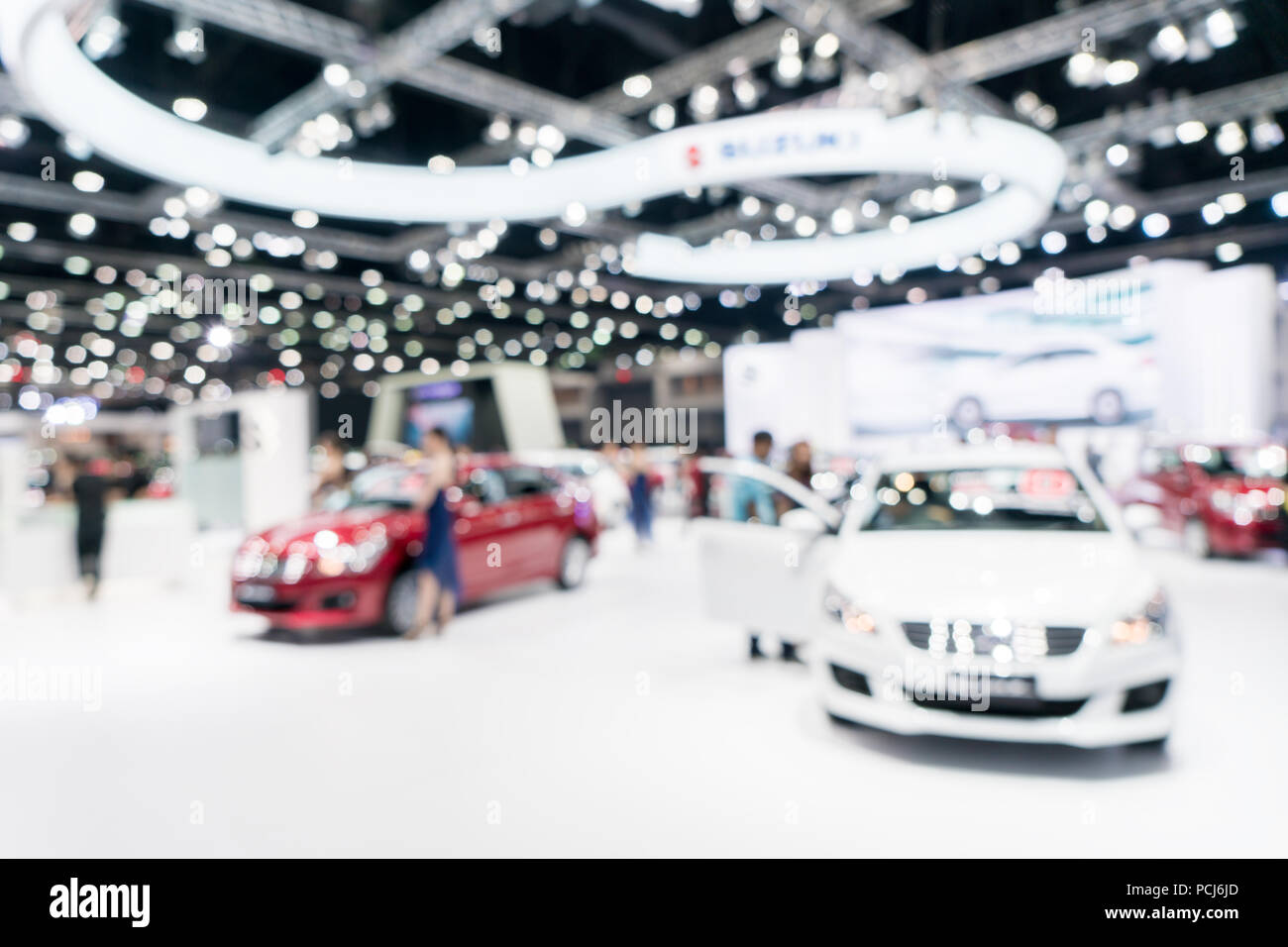 Blurred background of new car displayed in showroom. Car dealer. Stock Photo
