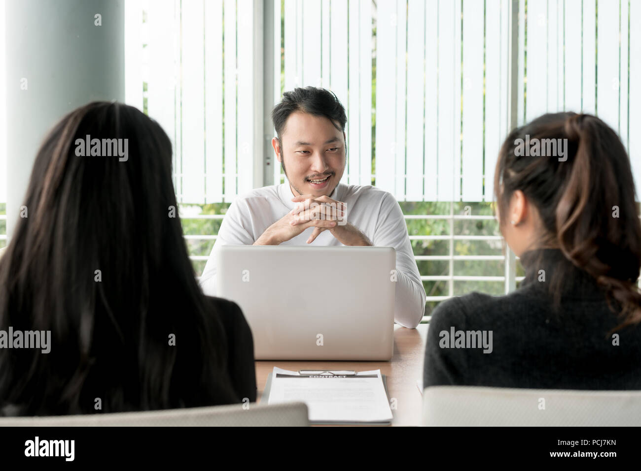Job interview - Photo of Asian businessman applicant during listen to candidate answers. Stock Photo
