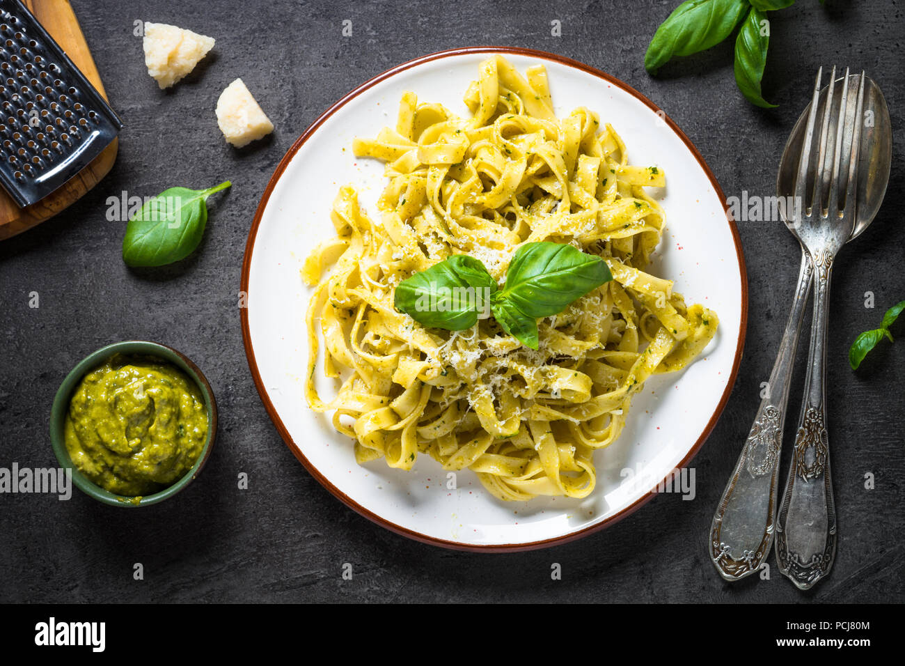 Tagliatelle pasta with pesto sauce and parmesan Stock Photo Alamy