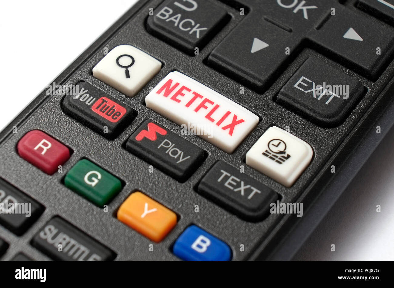 netflix and youtube buttons on television remote tv controller Stock Photo