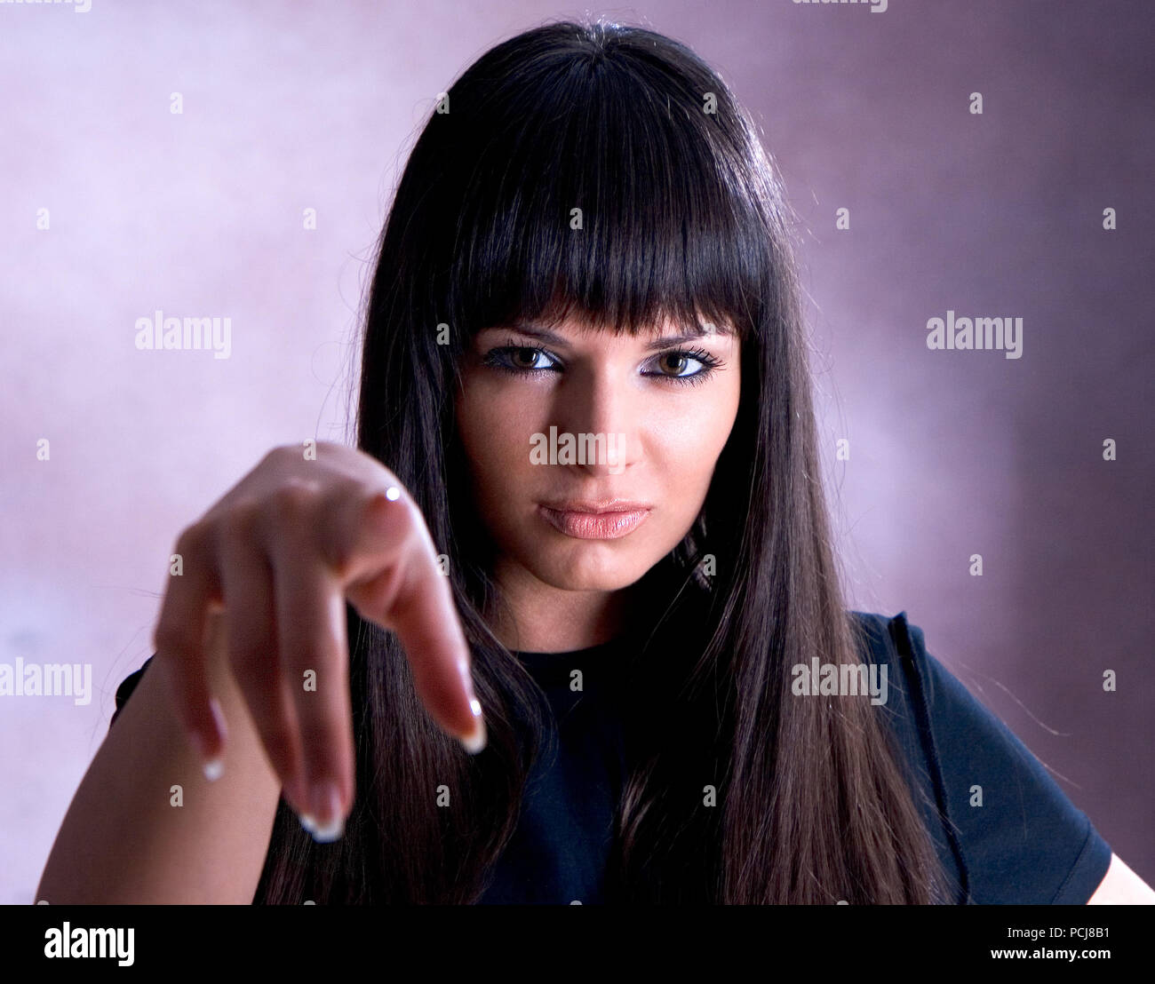 Woman pointing finger hi-res stock photography and images - Alamy