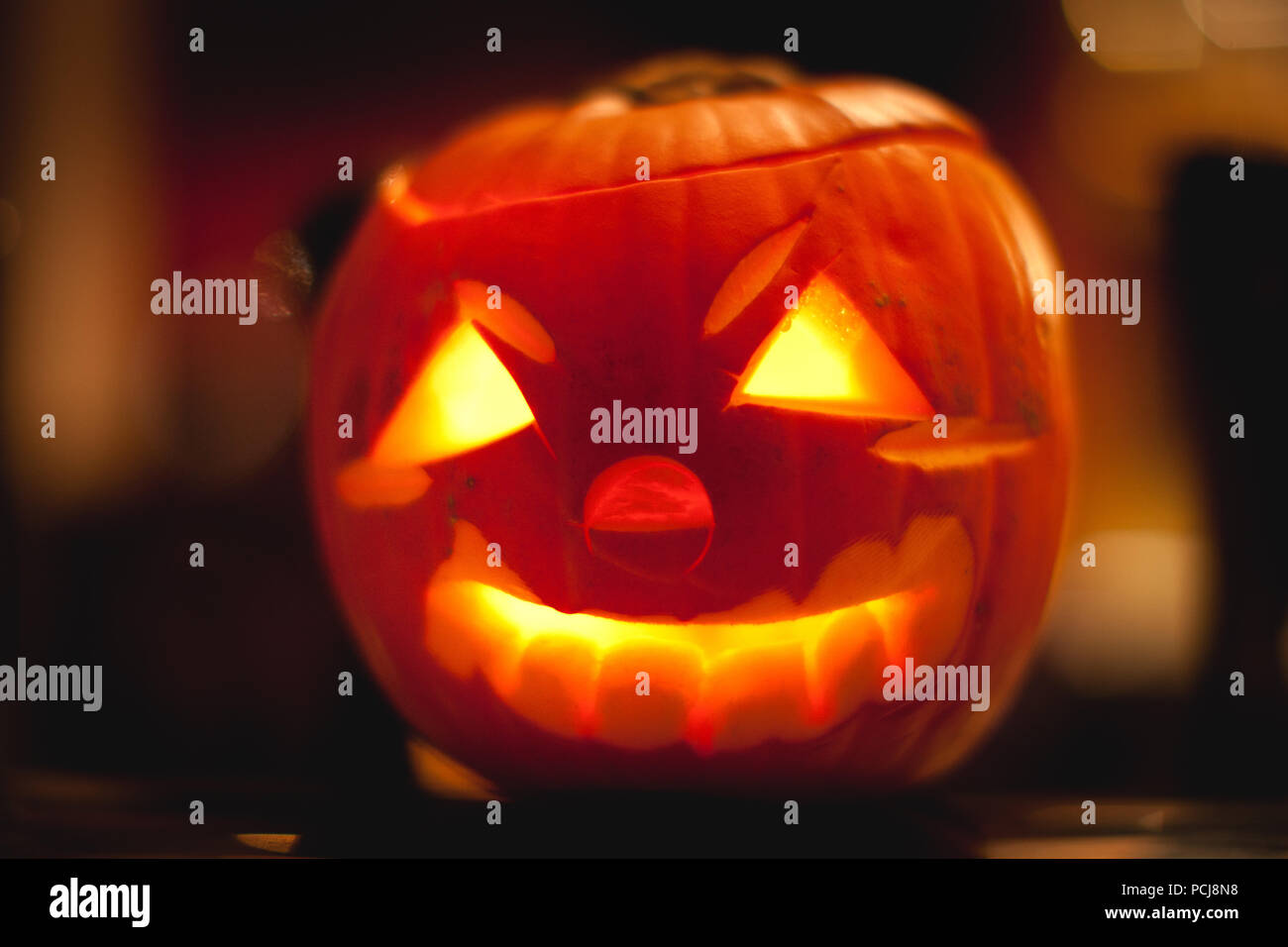 Carving out a pumpkin or Jack-O-Lantern to form a scary face is a Halloween tradition Stock Photo
